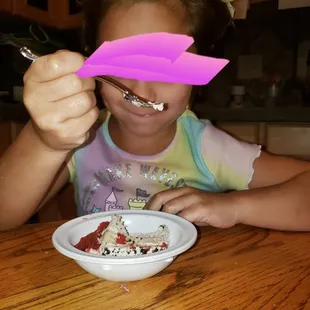 A sliver of red velvet AND cookies and cream cake samples made this little one happy!