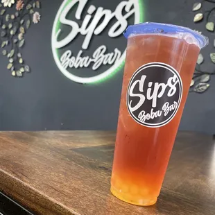 Hibiscus Green Tea , passion fruit syrup, mango popping boba