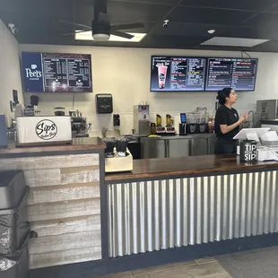 a woman standing at the counter