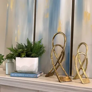 a couple of decorative items on a mantle