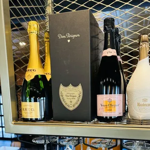 bottles of champagne on a shelf