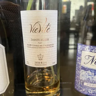 a glass of wine and a bottle of wine