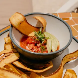 a bowl of soup and chips