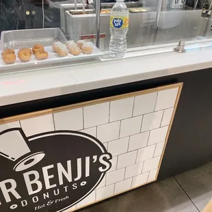 a counter with donuts