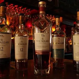 a row of bottles of macallaas
