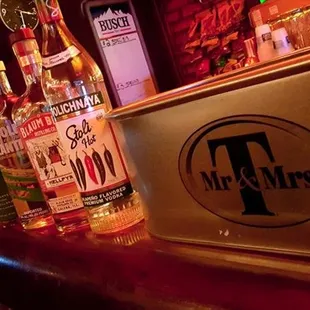 a selection of liquor bottles on a bar counter