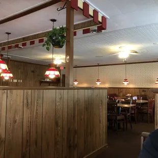 a man sitting at a table in a restaurant
