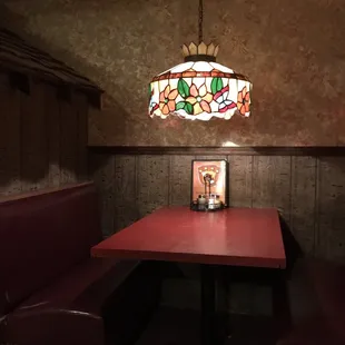 a table and booths in a restaurant