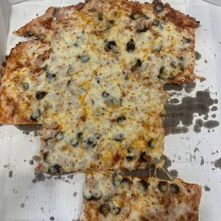 Large pizza with extra cheeses, pepperoni and black olives.