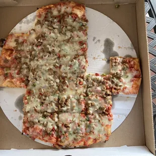 Sausage and pepperoni pizza, extra cheese, and green peppers