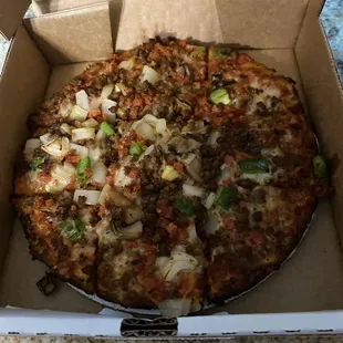 a whole pizza in a box