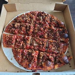 a whole pizza in a box
