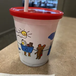 a plastic cup with a straw in it