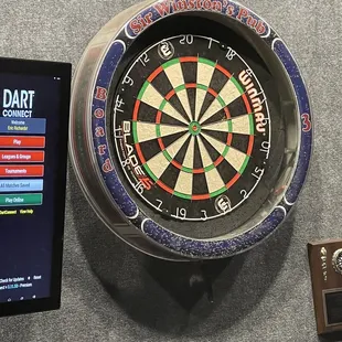 a dart board and a tablet