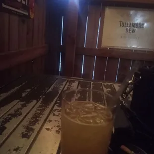 a glass of beer on a table