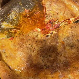 Stuffed meat pizza in a pool of grease.  It had almost leaked through the box.