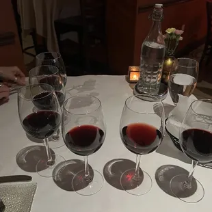 several glasses of wine on a table