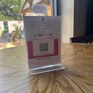 a bar and grill with a qr code on it