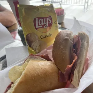 Italian meat sandwich and side.