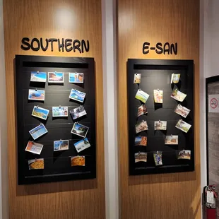 a wall with postcards on it