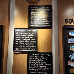 a wall with a menu and a clock