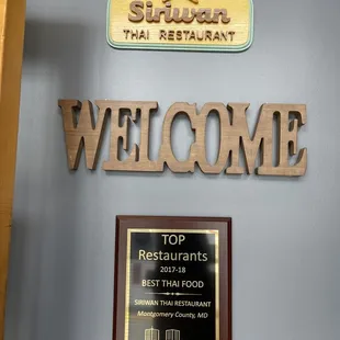 the restaurant's welcome sign