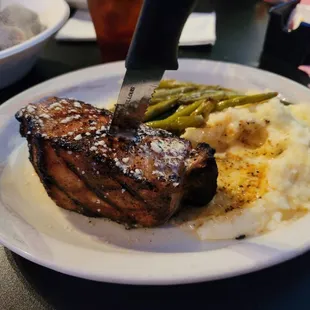 Porkchop, Garlic Mash Potatoes, and fresh green beans.