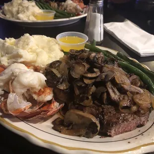 10oz Ribeye and 4oz lobster tail with mashed potatoes and green beans. Yum!