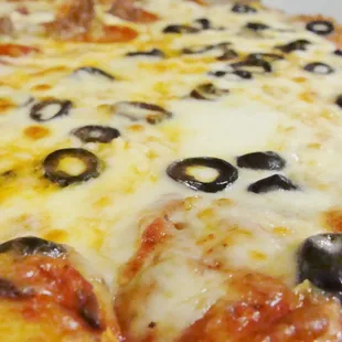 pizza with olives, garlic, and extra cheese.