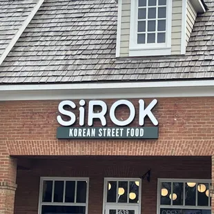 the front entrance of a korean street food restaurant