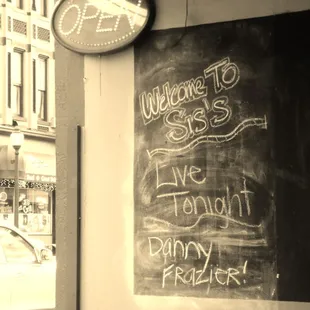 a chalkboard with a clock