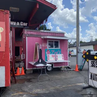 a taco truck parked in front of a building