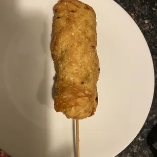Egg Roll comes on a wooden skewer.