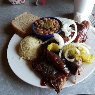 Brisket and sausage with beans and potato salad. Delicious!