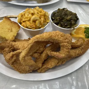 Catfish  with spicy Mac N cheese and greens and corn bread