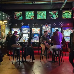 a group of people sitting at a bar