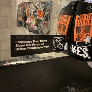 a public restroom with graffiti on the walls