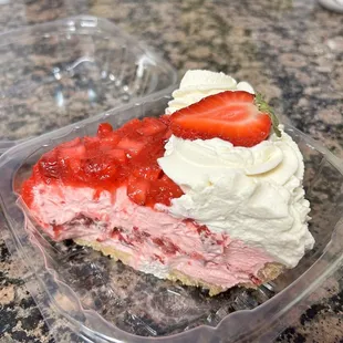 a slice of strawberry cream pie