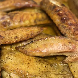 a closeup of a pan full of cooked fish
