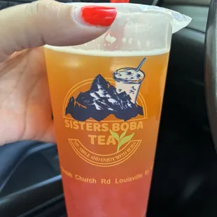 Peach Boba Tea with strawberry bubbles.