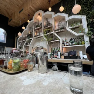 a bar with a variety of drinks