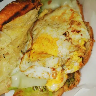 Eggepensive Large egg, provolone cheese, sprouts &amp; avocado in croissant