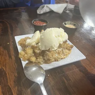 Warm apple crumble with ice cream