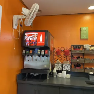 a soda machine and a soda dispenser