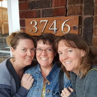 hree women posing for a picture