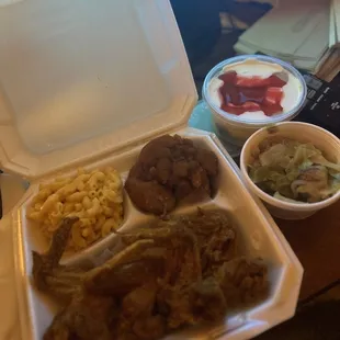 4 Pieces Wings, Mac and cheese, candied yams, cabbage and strawberry-banana pudding dessert.