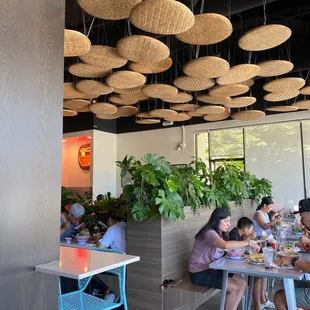 a group of people eating at a restaurant