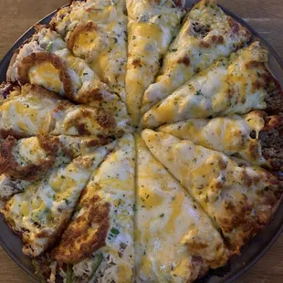 Left half: bbq chicken Right half: meat lovers