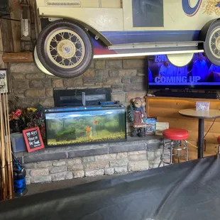 a flat screen tv and a fish tank