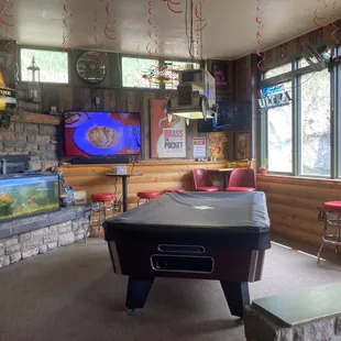 a billiards table and a tv